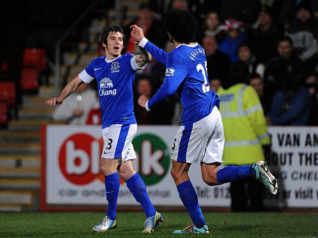 Leighton Baines celebrates with Marouane Fellaini after scoring his team's second goal against Cheltenham in the FA Cup on January 7, 2013