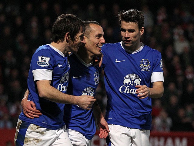 Leon Osman is congratulated by team mates Leighton Baines and Seamus Coleman after scoring his team's third goal against Cheltenham in the FA Cup on January 7, 2013
