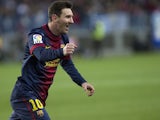 Lionel Messi celebrates a goal for Barcelona in the game against Malaga on January 13, 2013