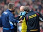 Liverpool goalkeeper Pepe Reina receives treatment after a clash with Manchester United's Shinji Kagawa on January 13, 2013