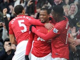 Manchester United defender Patrice Evra celebrates scoring his teams second goal against Liverpool on 13 January, 2013