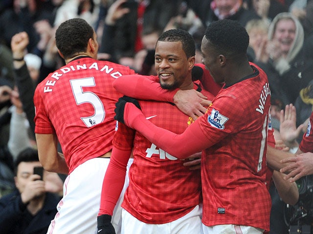 Manchester United defender Patrice Evra celebrates scoring his teams second goal against Liverpool on 13 January, 2013
