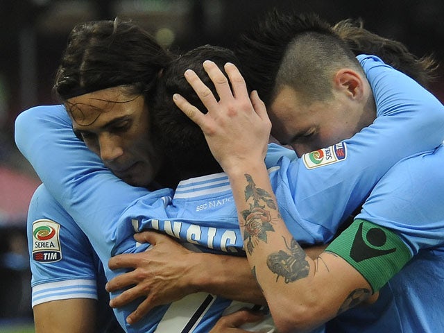 Napoli players Marek Hamsik and Edinson Cavani congratulate teammate Lorenzo Insigne for scoring his sides third goal in their Serie A match against Palermo on January 13, 2013