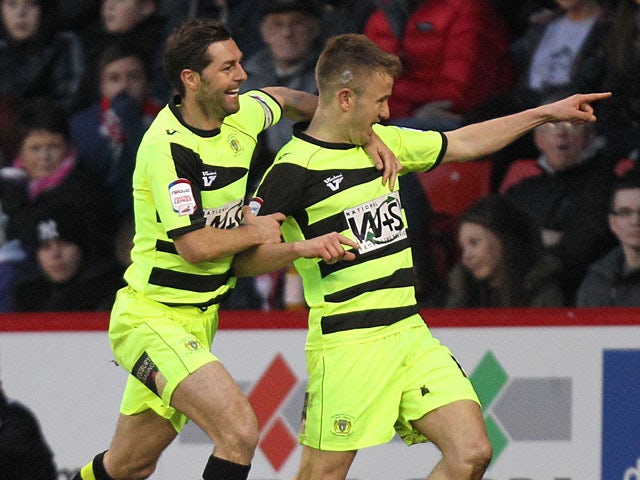 Yeovil Town's Paddy Madden celebrates moments after scoring the opening goal against Sheffield United on January 12, 2013