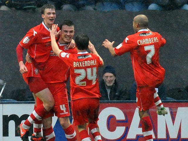 Walsall players congratulate goalscorer Paul Downing after a goal against Preston on January 13, 2013