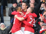 Manchester United striker Robin van Persie celebrates with teammates during his sides match against Liverpool on 13 January, 2013