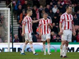 Jonathan Walters is consoled by his team mate Ryan Shawcross after scoring an own goal against Chelsea on January 12, 2013