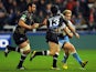 Charlie Amesbury of Sale Sharks is tackled by two Montpellier players during thier match on January 11, 2013