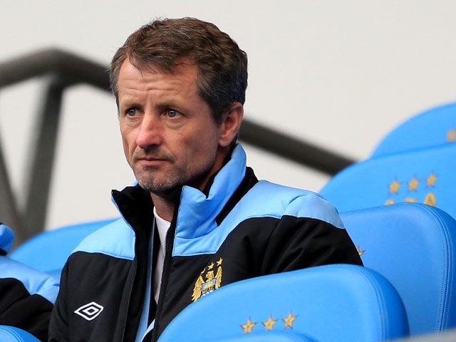 Manchester City academy coach Scott Sellars watches on as City play Norwich City at the Etihad Stadium on 3 December, 2011