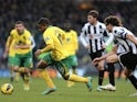 Norwich striker Simeon Jackson turns away from Newcastle's Fabricio Coloccini on January 12, 2013