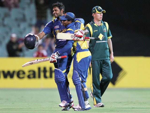 Lahiru Thirimanne (left) celebrates scoring a century for Sri Lanka against Australia on 13 January, 2013