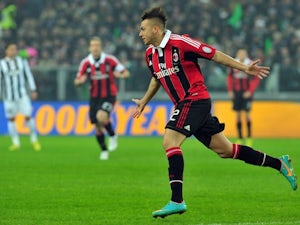 Milan edge out 10-man Atalanta