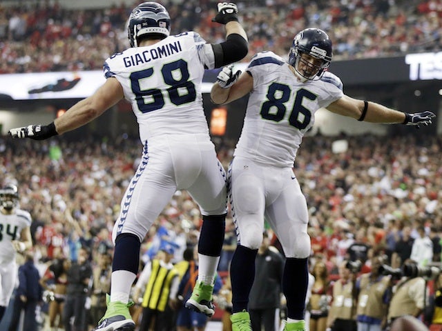 Seahawks TE Zach Miller celebrates a touchdown with Breno Giacomini after a touchdown after Atlanta on January 13, 2013