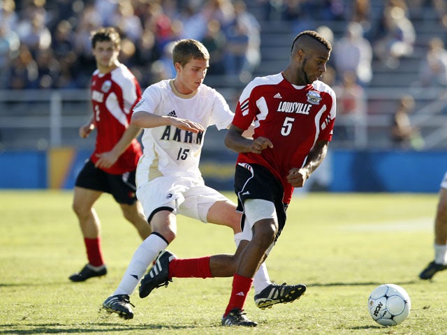 Andrew Farrell dribbles the ball while playing for the University of Louisville on December 11, 2010