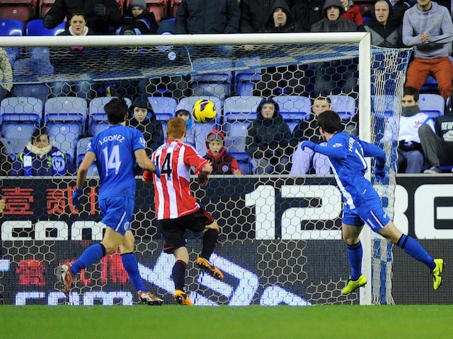 Wigan's on-loan forward Angelo Henriquez heads in his first goal for the club against Sunderland on January 19, 2013