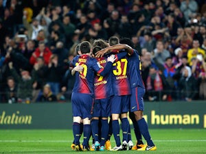 Barcelona players celebrate their second goal against Malaga in the Copa del Rey on January 16, 2013