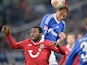 Schalke's Benedikt Hoewedes and Hannover's Mame Biram Diouf battle for the ball in the air on January 18, 2013