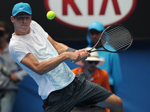 Tomic "relieved" to edge out Brands