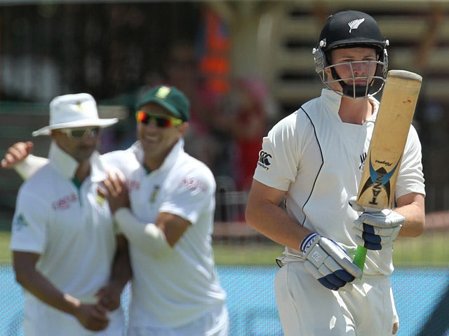 New Zealand's batsman BJ Watling leaves the field after being bowled out by South Africa's bowler Dale Steyn on January 14, 2013