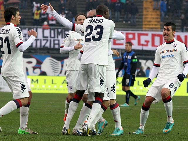 Cagliari players celebrate after opposition Atalanta score an own goal on January 20, 2013