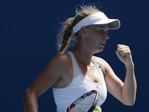 Wozniacki battles back to defeat Kvitova