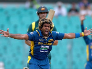 Sri Lanka's Lasith Malinga celebrates taking the wicket of Australia's Mitchell Johnson on January 20, 2013