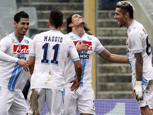 Napoli's Edinson Cavani is congratulated by team mates after heading in the equaliser against Fiorentina on January 20, 2013