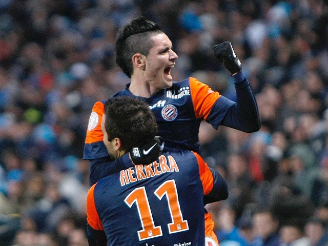 Emanuel Herrera is congratulated by team mate Remy Cabella after scoring the equaliser against Marseille on January 19, 2013
