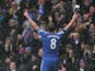 Frank Lampard celebrates in front of the Chelsea fans after scoring a penalty and his team's second goal against Arsenal on January 20, 2013