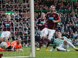 Celtic's Gary Hooper slots in the opener against Hearts on January 19, 2013
