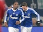 Schalke's Jefferson Farfan is congratulated by team mate Julian Draxler after scoring the opening goal against Hannover on January 18, 2013