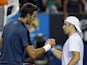 Juan Martin Del Potro shakes hands with Benjamin Becker following their second round match on January 17, 2013