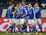 Schalke's Julian Draxler is congratulated by team mates after scoring his team's second goal against Hannover on January 18, 2013