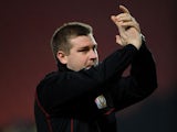 Manager of MK Dons Karl Robinson applauds the fans during his sides FA Cup match on January 15, 2013