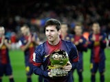 Lionel Messi poses with his FIFA Men's World Player of the Year award before the Copa del Rey match against Malaga on January 16, 2013