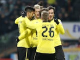 Dortmund players celebrate with Marco Reus following his goal against Werder Bremen on January 19, 2013