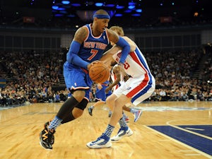 Carmelo Anthony of the New York Knicks gets away from Detroit Pistons player Kyle Singler on January 17, 2013