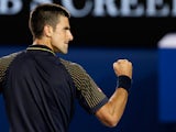 Novak Djokovic punches the air during the his fourth round match against Stanislas Wawrinka on January 20, 2013