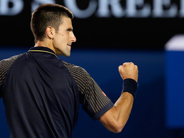 Novak Djokovic punches the air during the his fourth round match against Stanislas Wawrinka on January 20, 2013
