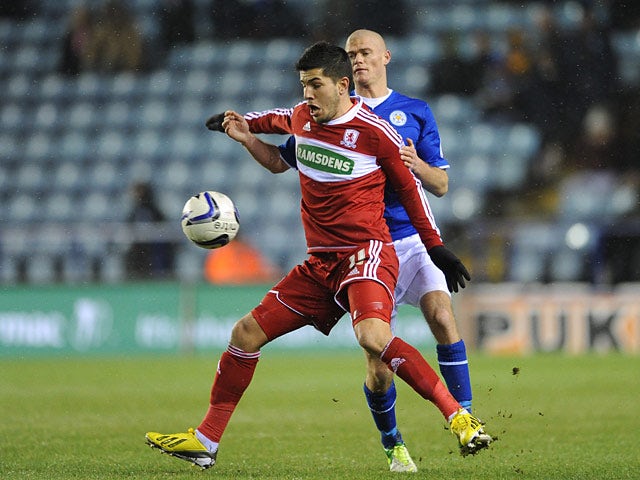 Leicester City's Paul Konchesky and Middlesbrough's Emmanuel Ledesma battle for the ball on January 18, 2013