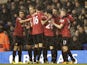 Man Utd players congratulate Robin Van Persie after opening the scoring against Tottenham on January 20, 2013