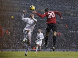 United forward RVP heads home the first goal against Tottenham on January 20, 2013