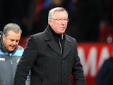Manchester United boss Sir Alex Ferguson leaves the field at the final whistle after beating West Ham 1-0 during the FA Cup third round replay on January 16, 2013