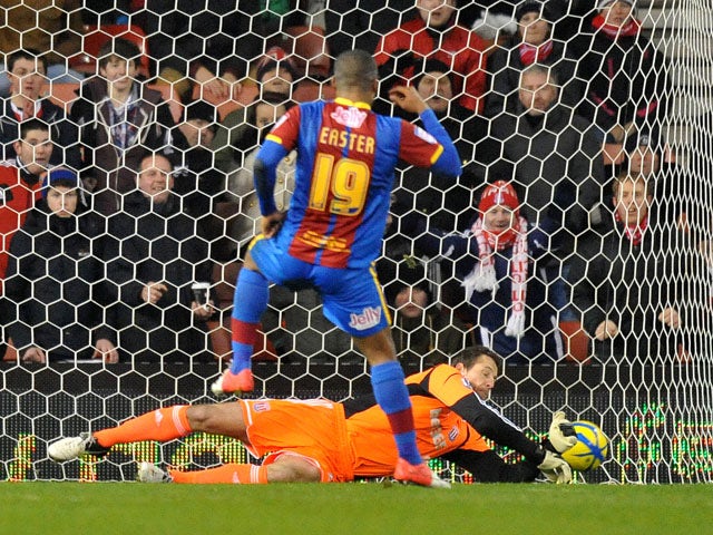 Stoke City goalkeeper Thomas Sorenseen saves a penalty for his side in their match with Crystal Palace on January 15, 2013