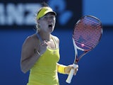 German Angelique Kerber celebrates after winning her first round match against Elina Svitolina at the Australian Open tennis championship on January 14, 2013