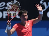 Carla Suarez Navarro waves to the crowd after winning her first round clash against Sara Errani at the Australian Open tennis championship on January 15, 2013