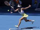 Caroline Wozniacki hits a forehand return in her first round match at the Australian Open tennis championship on January 15, 2013