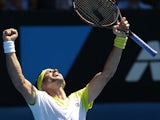 Spain's David Ferrer celebrates winning his fourth round match at the  Australian Open tennis championship on January 20, 2013