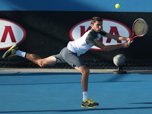 France's Gilles Simon hits a shot during his match with Filippo Volandri during the first round of the Australian Open tennis championship on January 15, 2013