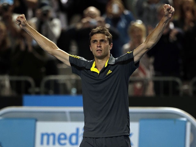 France's Gilles Simon celebrates after winning his third round match at the Australian Open tennis championship on January 20, 2013
